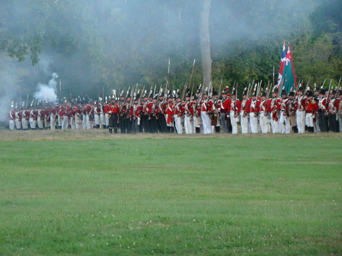 War of 1812 British line of soldiers preparing to fire. This picture is from the re-enactment at Fort Erie, Ontario. Creative Commons Attribution 3.0 Unported license